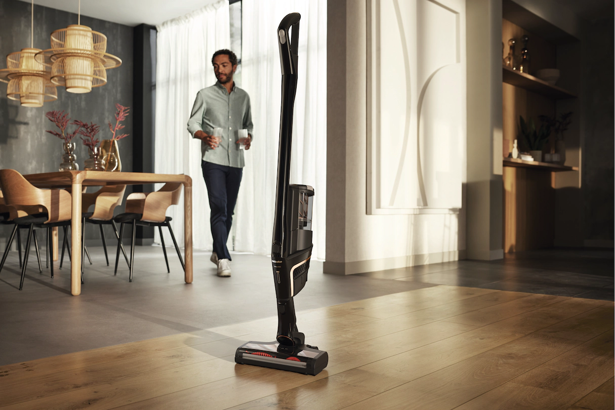 Miele vacuum in a modern room with man in background